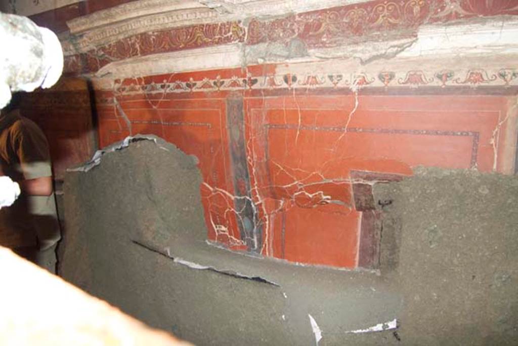 Villa dei Papiri, Herculaneum. July 2010. Room (I) on lower terrace, lower east wall of hall.
This wall has regained some of its painted plaster in the four minutes since the photo of the antechamber east wall shown above.
Photo courtesy of Michael Binns.
According to Guidobaldi and Esposito, the stuccoes have been excavated thanks to the constant and essential support of the restorers, who isolated and recovered each single fragment and at the same time consolidated and cleaned the surface of the stuccoes and of the paintings that were progressively unearthed during the excavation of the vault and the walls.
See Esposito D. and Guidobaldi M., 2010. New Archaeological Research at the Villa of the Papyri, in the Villa of the Papyri at Herculaneum. Berlin: De Gruyter, p. 34 note 28.